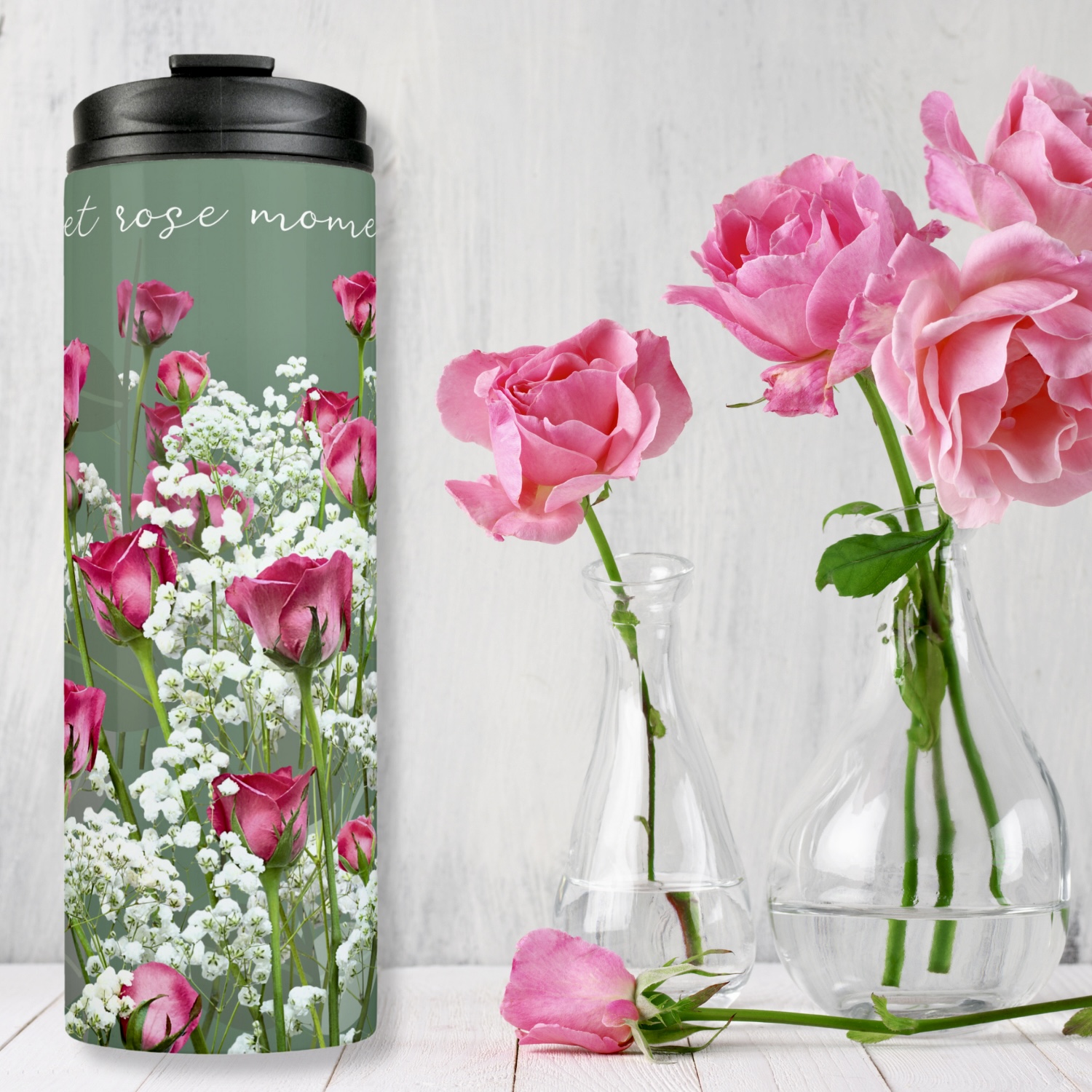 Soft green thermal tumbler with pink roses and white flowers, with inspirational quote “sweet roses moments”.