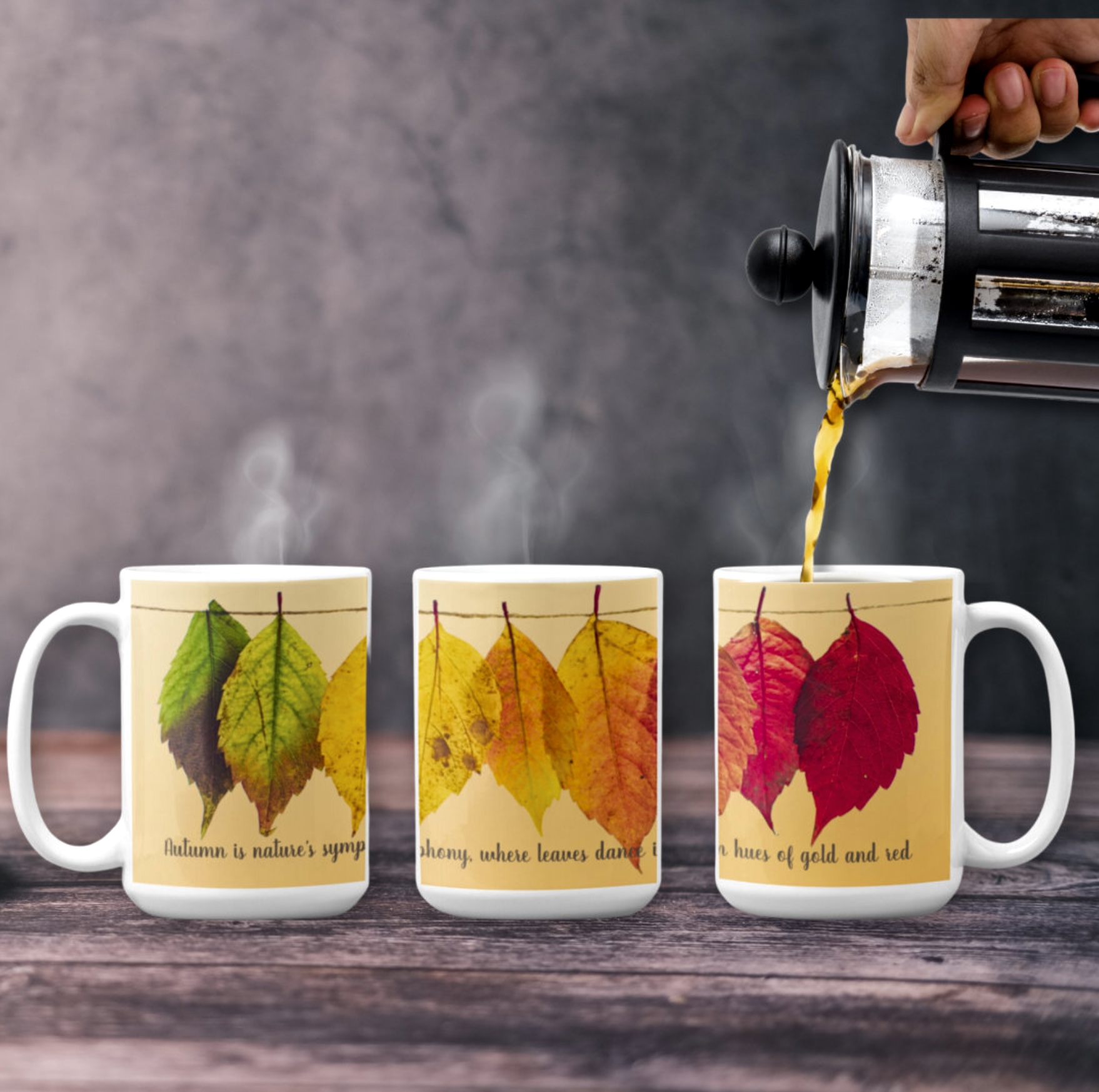 Three sided coffee mug with red, orange and green dry leaves, and inspirational quote. Fall season design.