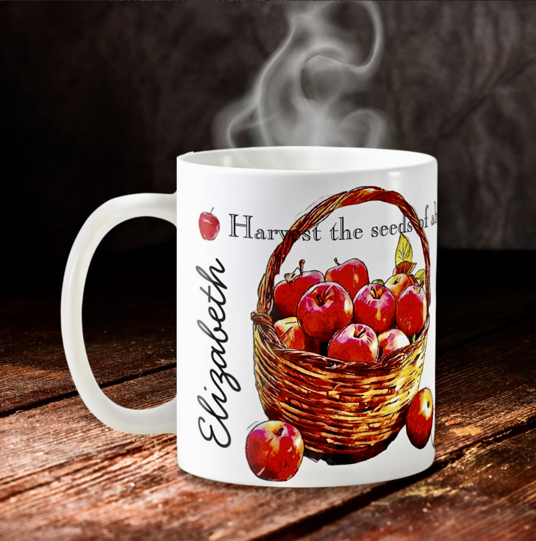 White mug with a basket with red apples and a name.