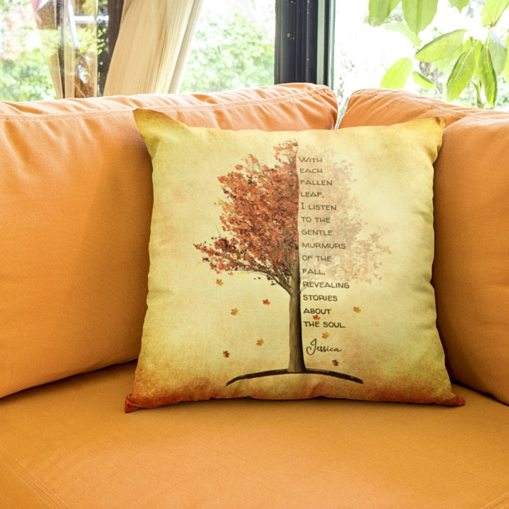 Yellow pillow with red maple tree and inspirational quote.