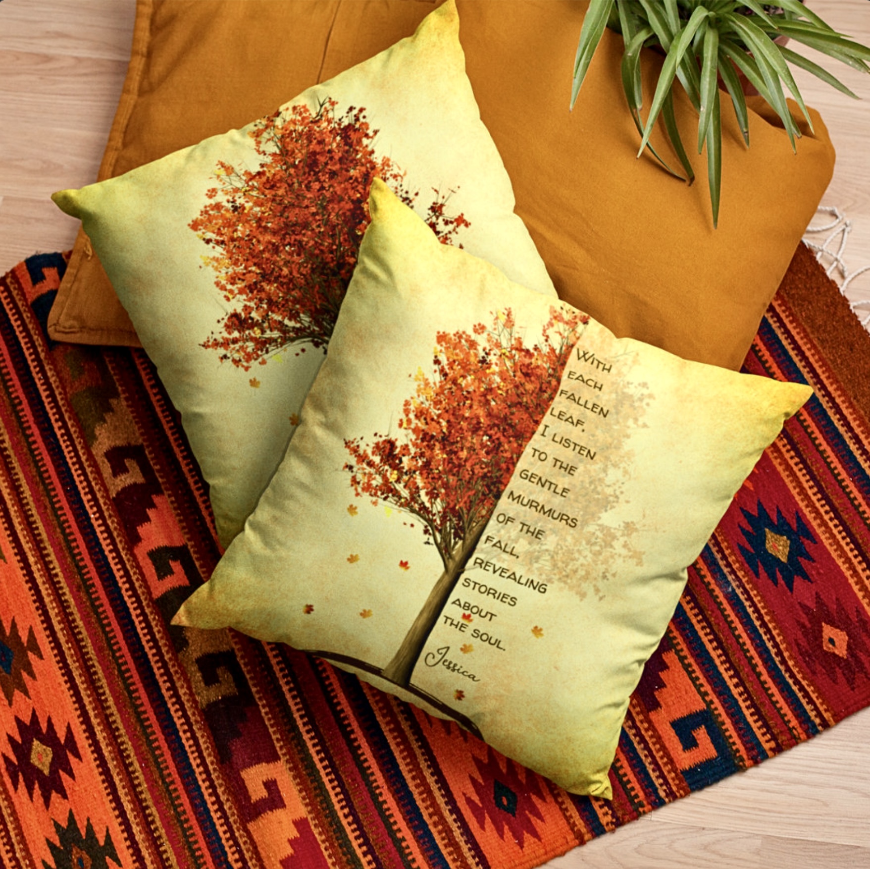 Two throw pillows with maple red tree design and inspirational quote.