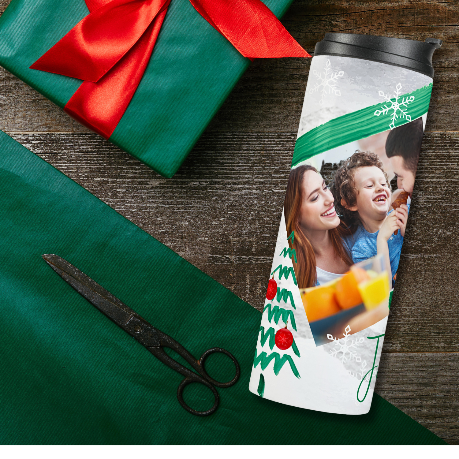 Side view of a two picture frame christmas tumbler with a christmas tree drawing