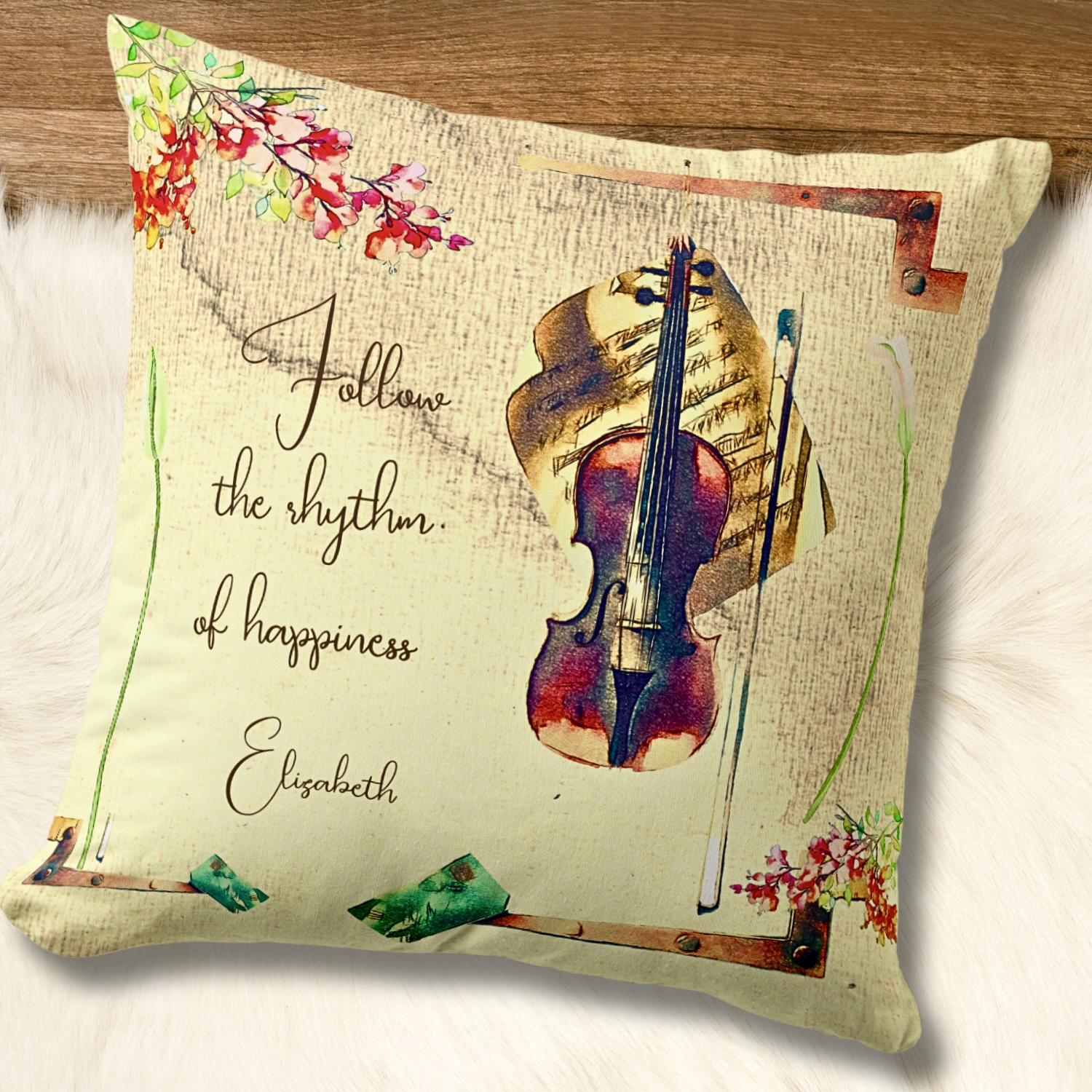 Throw pillow with a violin image and bougainvilleas over a washed out beige background.