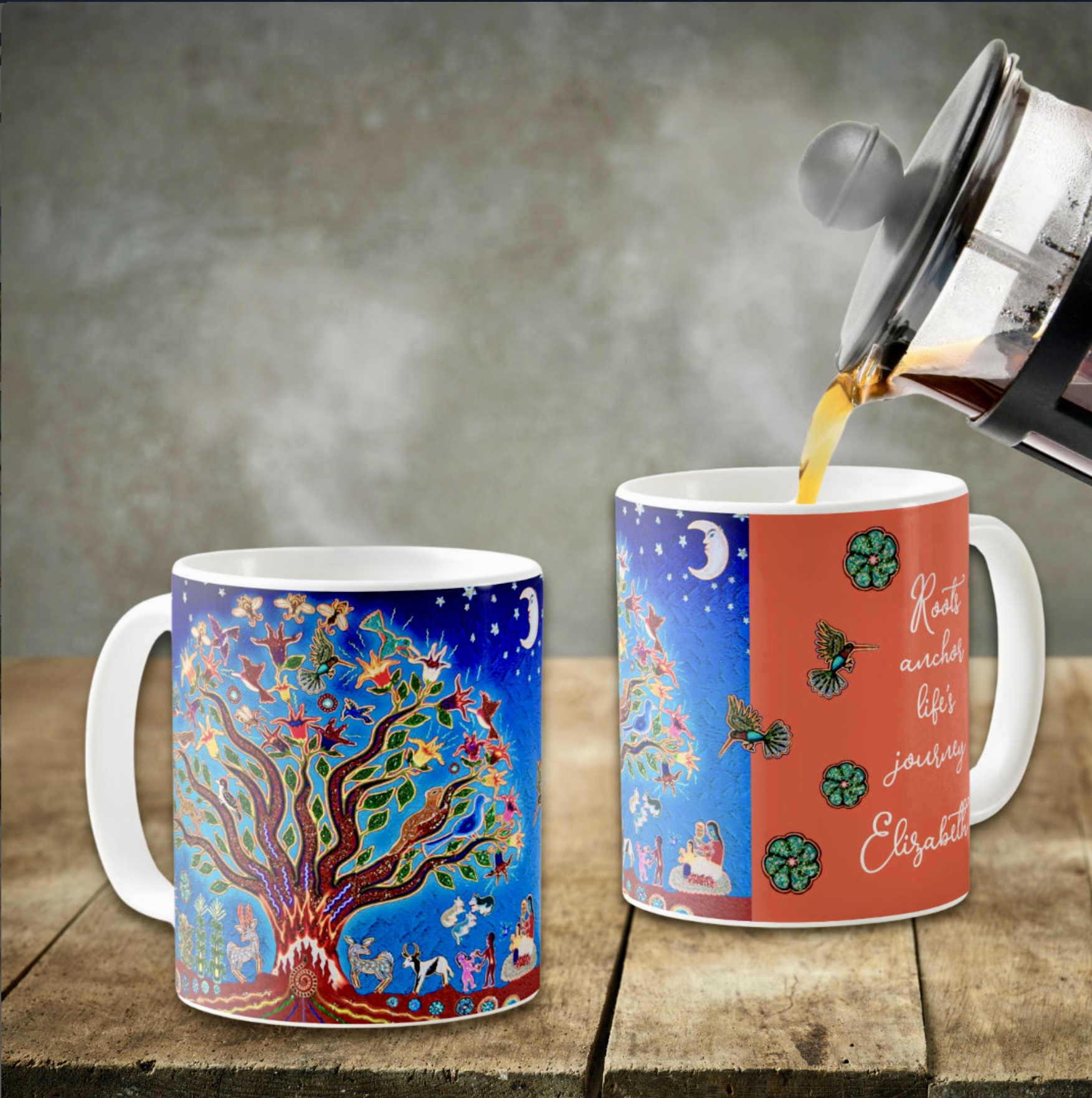 Two coffee mugs. One has a colorful tribal image about nature against the night sky, and the other one shows an inspirational quote on a peach orange background.