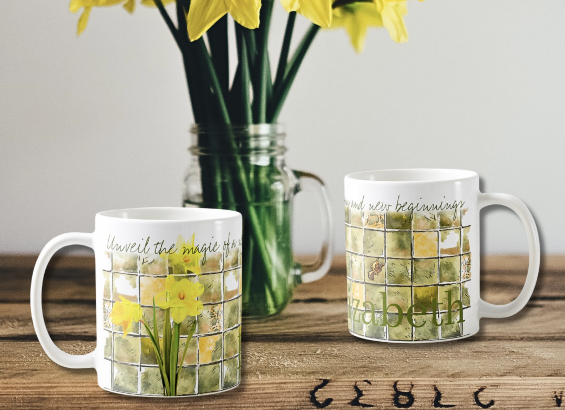 Two coffee mugs with daffodils watercolor illustration in yellow and green with inspirational message that reads Unveil the magic of a new day and new beginnings.