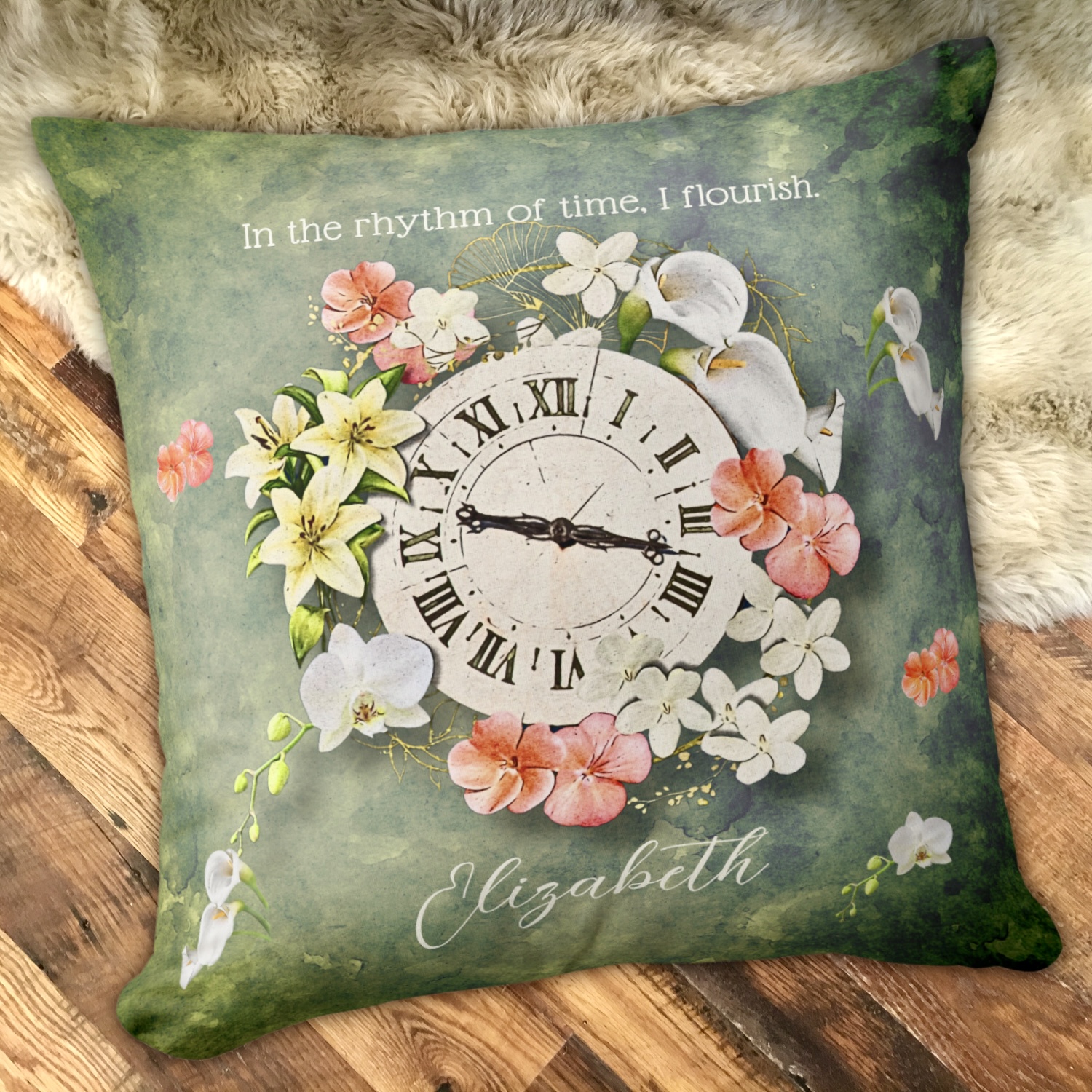 Moss green throw pillow with a vintage clock surrounded by soft color flowers, an inspirational message on the top and a name space at the bottom.