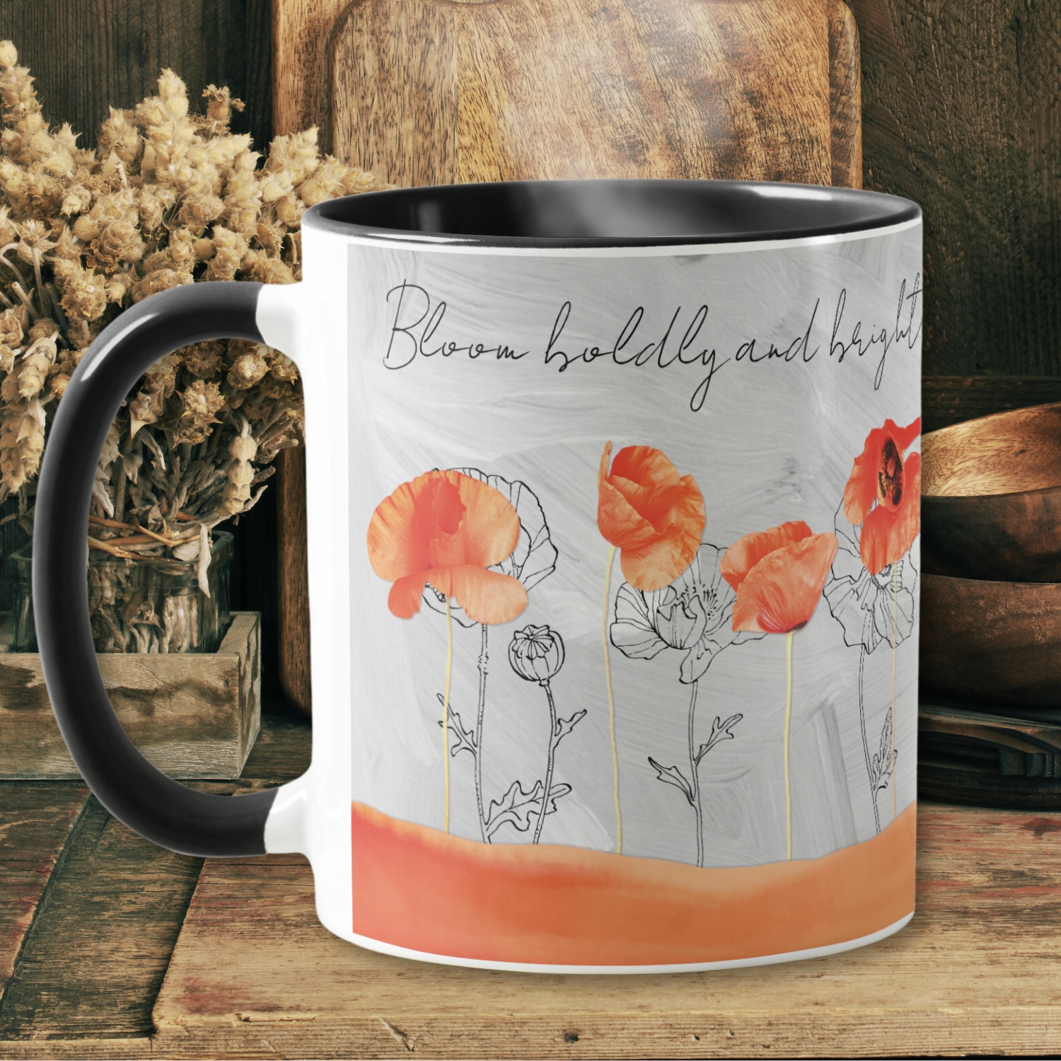 Close up look of a gray washed out coffee mug with peach color poppy flowers, and an inspirational message.