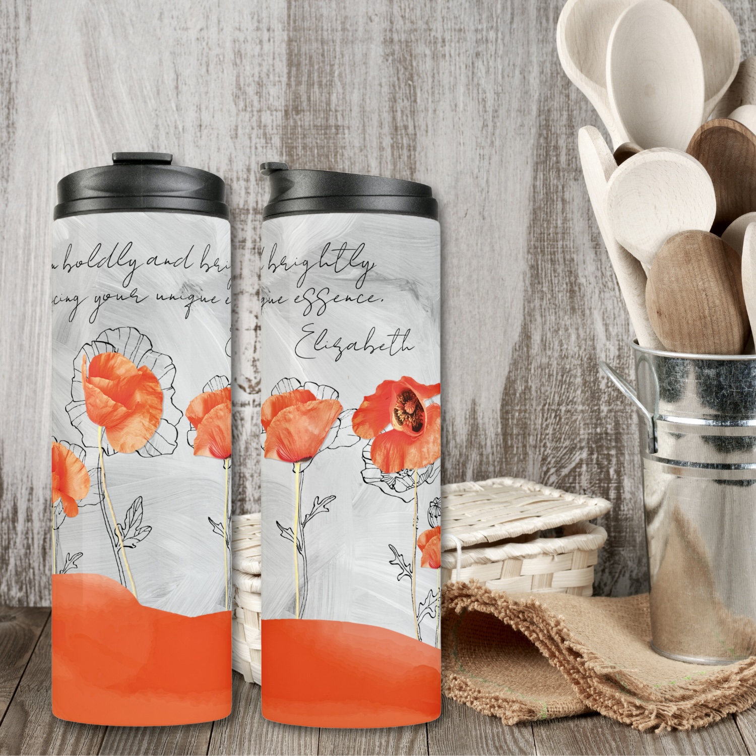 Two gray tumblers with peach color poppy flowers and space for inspirational message, and name.