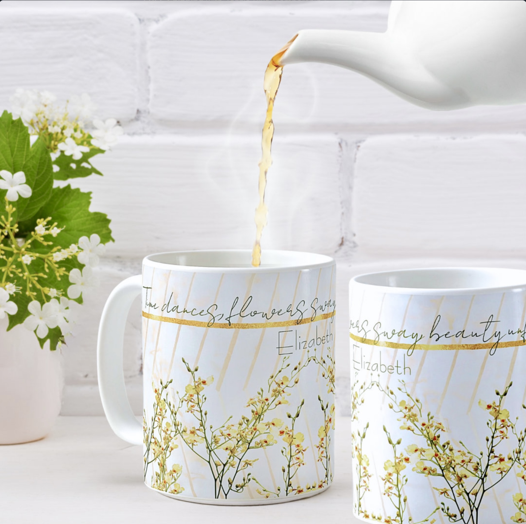 Two white coffee mugs with yellow wildflowers and diagonal golden ribbons. Includes an inspirational message, and a space for name personalization.