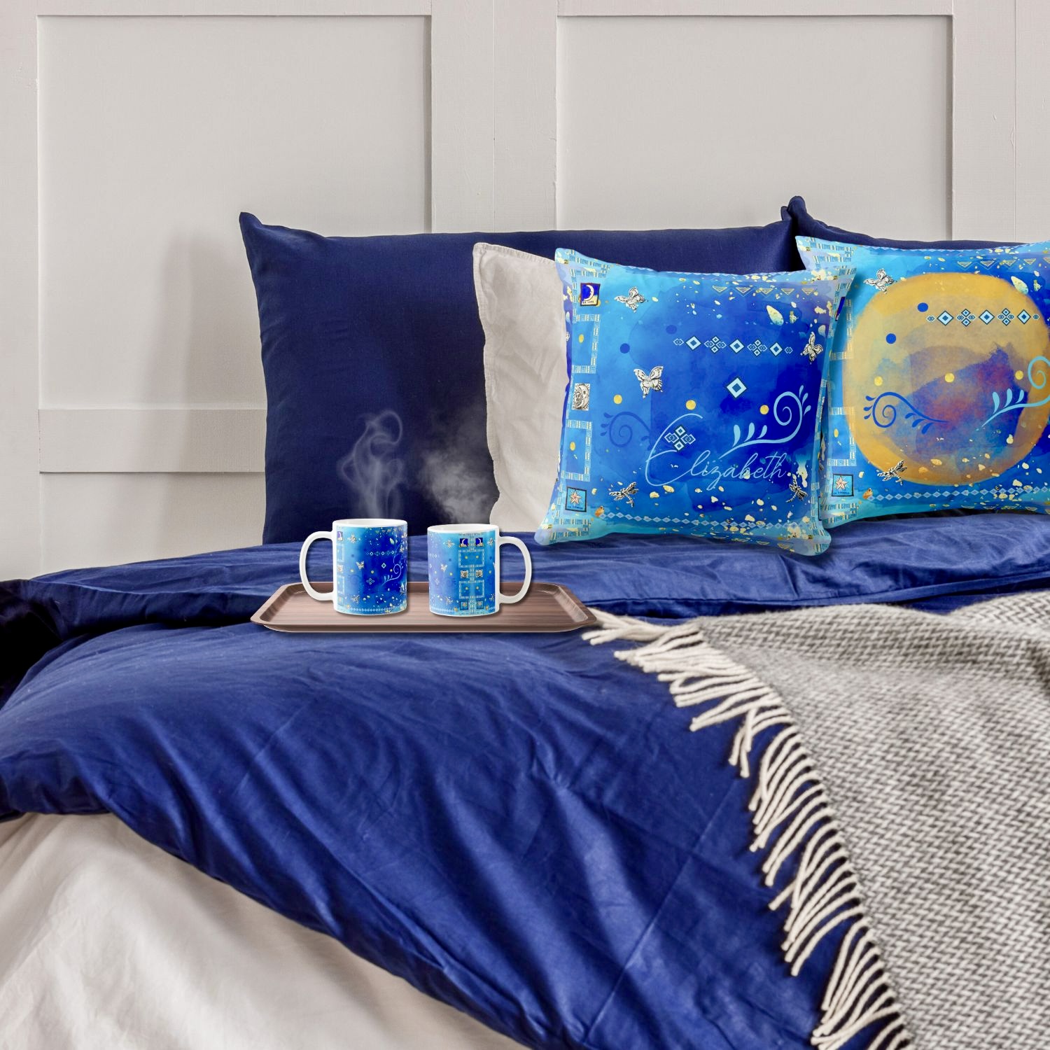 Tribal blue and golden mug and pillow with bohemian design, customizable with name.