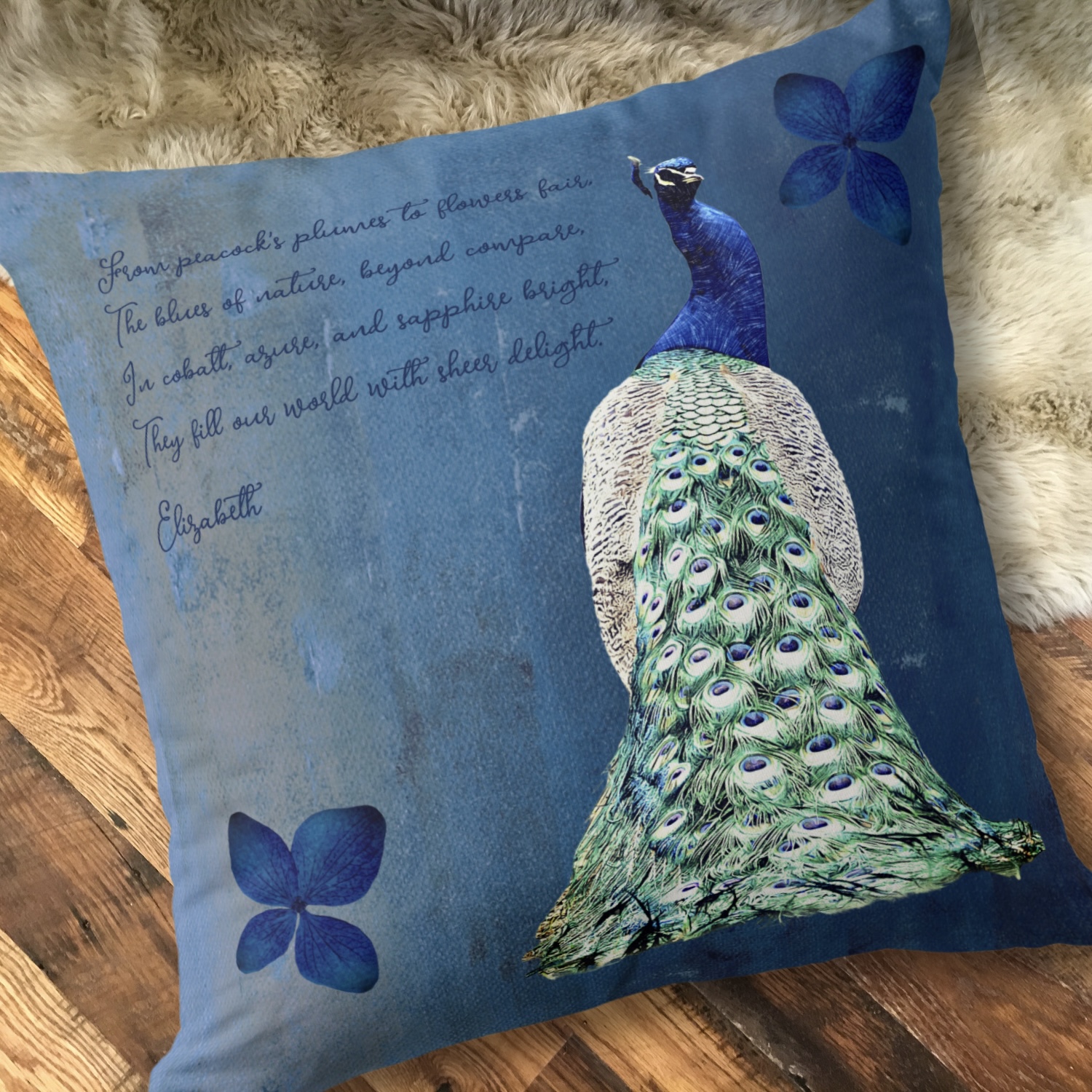 Washed out cobalt blue throw pillow with a blue peacock as center image, and an inspirational message. Nostalgic vintage design.