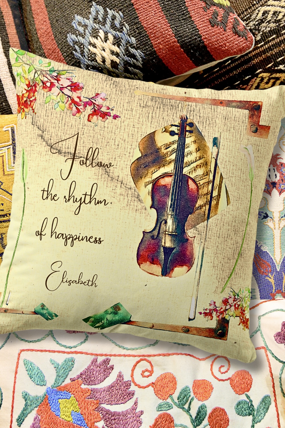 Beige throw pillow with a vintage violin and bougainvilleas, with personalized message about happiness.