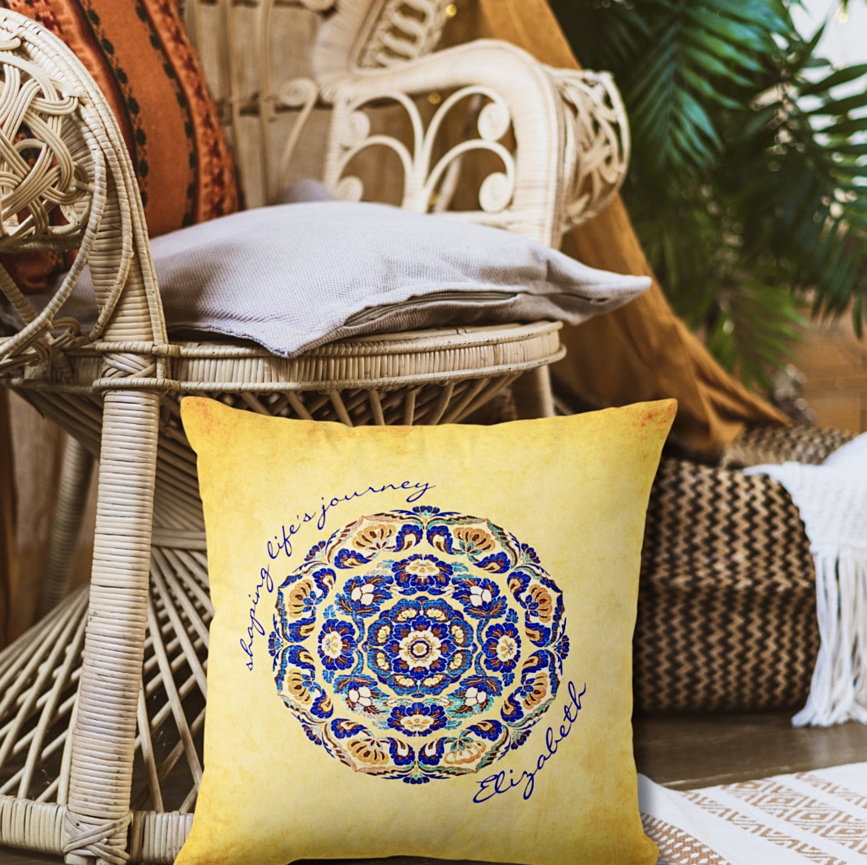 Customizable orange yellow pillow with a blue flower medallion on the center and inspirational message around it.