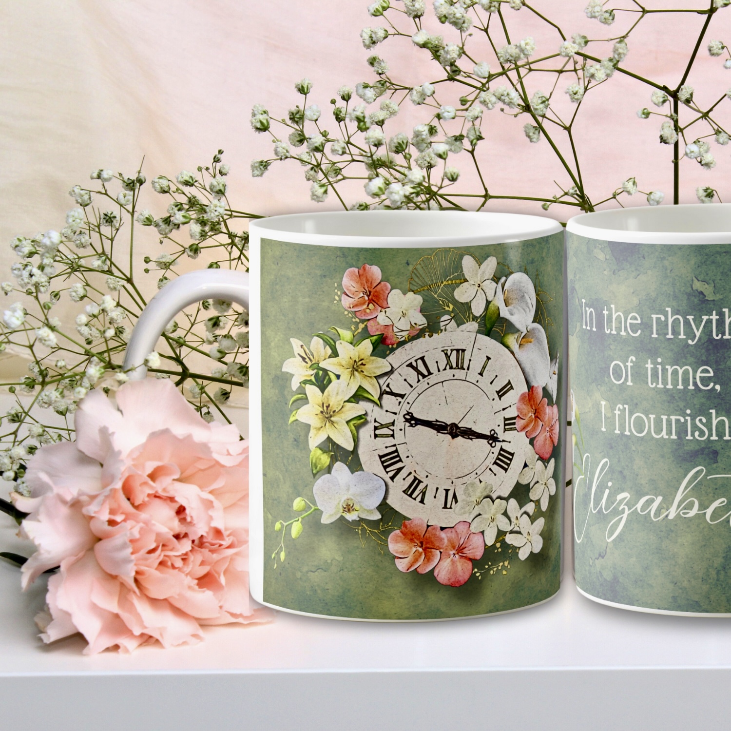 Two moss green coffee mugs with a vintage clock and flowers, inspirational message and space for name.
