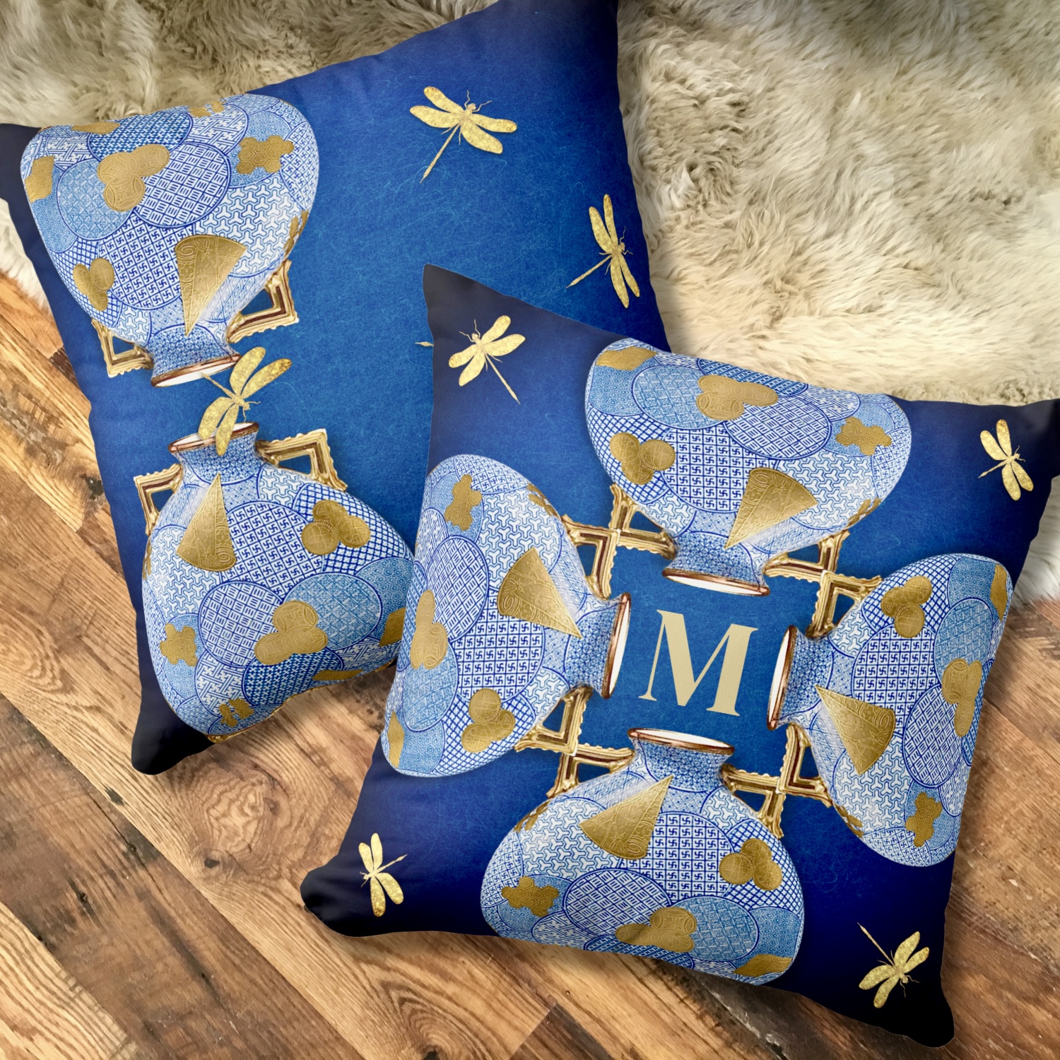 Two-sided Japanese-style blue and gold throw pillow, showcasing intricate monogramming on one side and delicate circle patterns with golden leaf motifs on the other. A versatile and elegant accent for home decor.