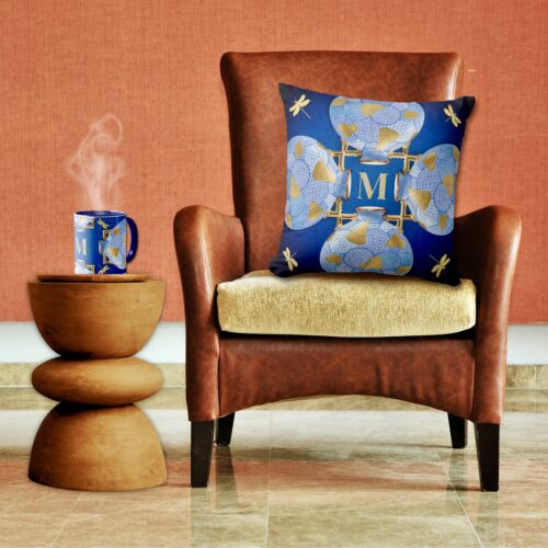 A blue and gold throw pillow and mug inspired by vintage Japanese art, featuring intricate patterns and a monogrammed initial for personalized flair. Mugs and pillows from public domain masterpieces.