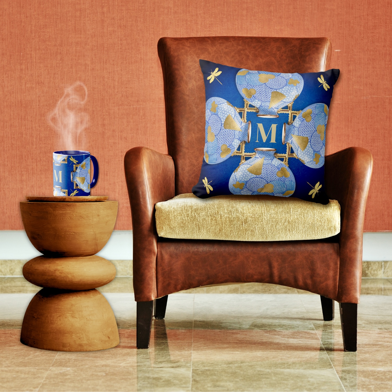 A blue and gold throw pillow and mug inspired by vintage Japanese art, featuring intricate patterns and a monogrammed initial for personalized flair.