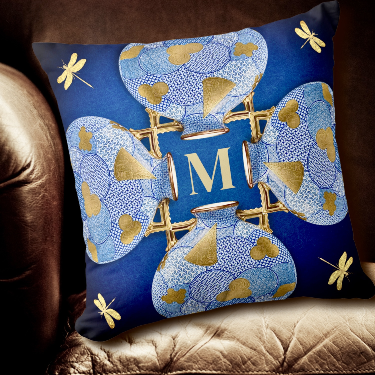 Japanese-inspired blue and gold decorative pillow featuring intricate monogramming, forming part of a coordinated set with a matching mug and tumbler. Reflects elegance and sophistication in home decor.