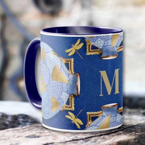 Elegant East Asian mug adorned with blue circled patterns and gold leaf motifs. Mug has a matching pillow.