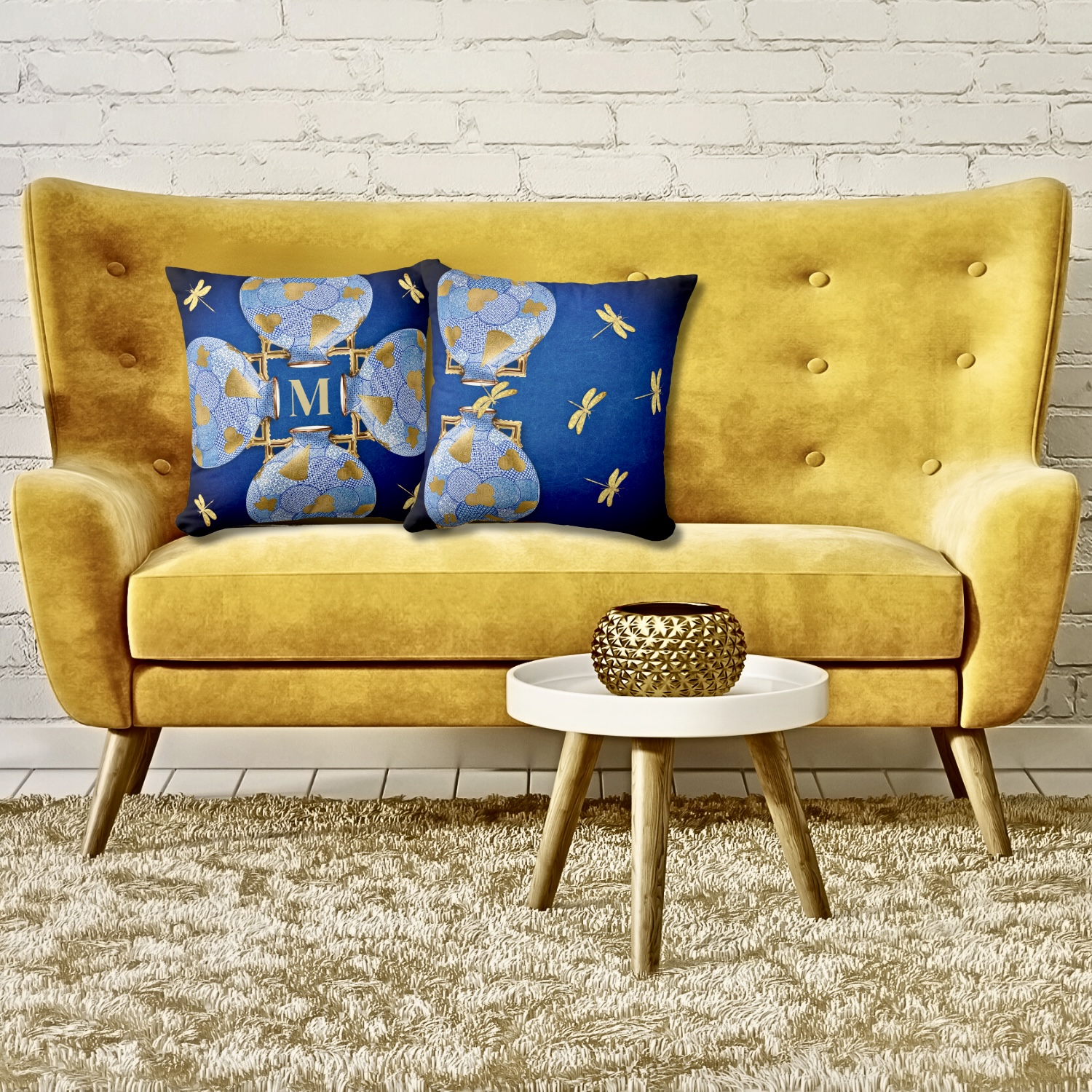 Unique luxury blue and gold throw pillow, showing front and back views, elegantly placed on a striking yellow-golden sofa.