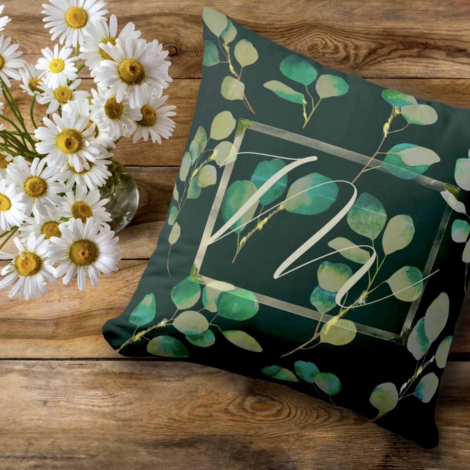 Personalized home decor featuring a Moody Green Monogrammed Throw Pillow with intricate leaf designs.
