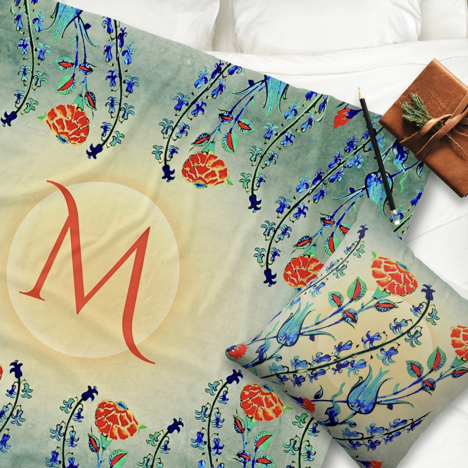 Step into vintage charm with an Antique Floral Monogram Fleece Blanket and coordinating Throw Pillow. Delicate floral patterns in shades of blue, green, and red adorn both, evoking elegance and warmth.