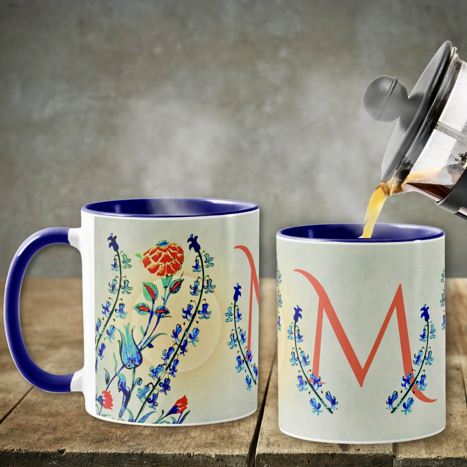 Vintage floral coffee mug featuring blue and bright orange flowers evocative of Ottoman Dynasty motifs, set against a gradient background resembling a sunset. Shown alongside the same mug from the side, displaying the identical vintage floral design.