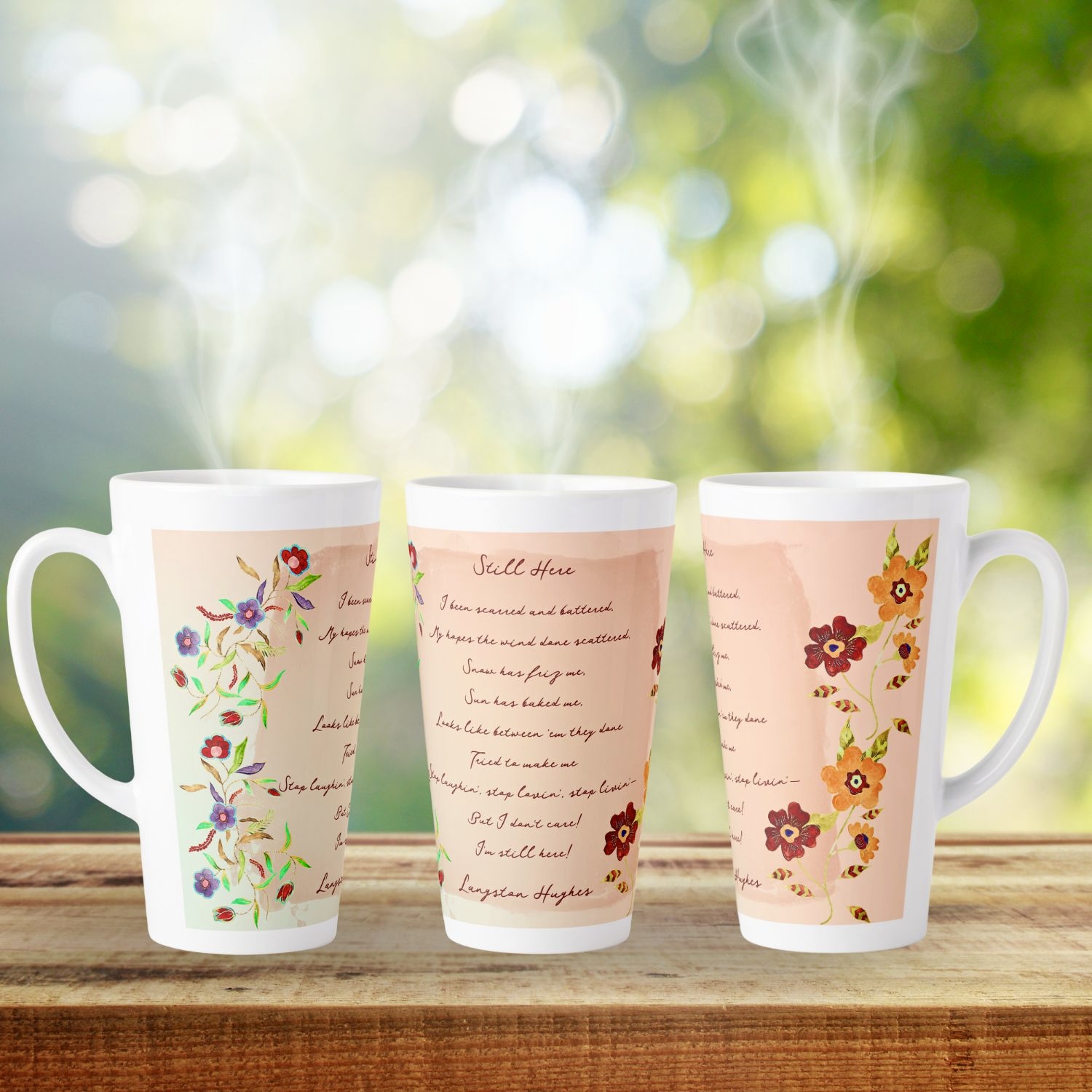 Coffee latte mug featuring a serene design inspired by delicate watercolor flowers and a coral-toned mandala, evoking elegance and tranquility. A subtle touch of literary inspiration with Langston Hughes' poem 'Still Here' adds depth to the design, inviting contemplation while enjoying your favorite hot beverage.