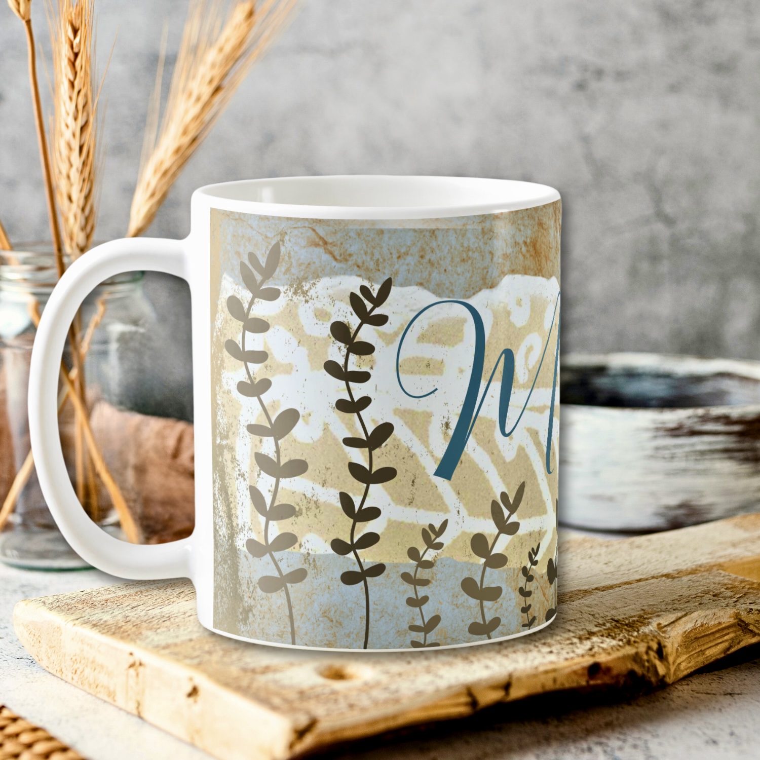 Mug with ethnic earthy tones in browns, beiges, and light blues. With space for initial monogram.