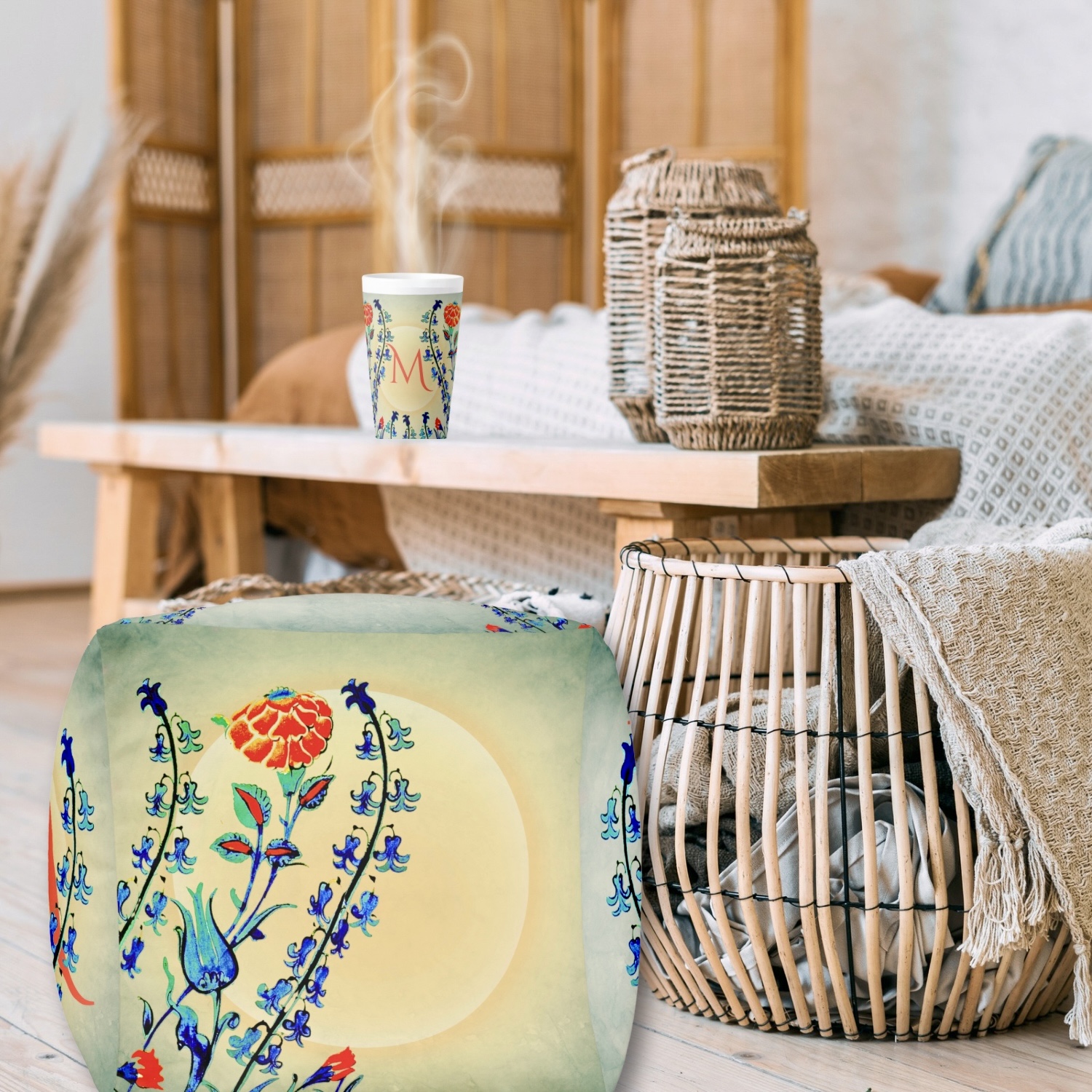 Delicate floral patterns in shades of blue, green, and red adorn the Antique Floral Monogram Pouf and Latte Mug, infusing any space with vintage charm and timeless elegance.