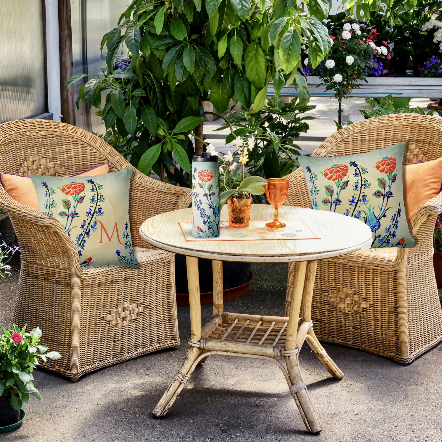 Vintage floral thermal tumbler and throw pillow featuring blue and bright orange flowers reminiscent of Ottoman Dynasty motifs, flowers design set against a gradient background resembling a sunset. The tumbler and pillow are displayed alongside each other, showcasing the identical vintage floral design