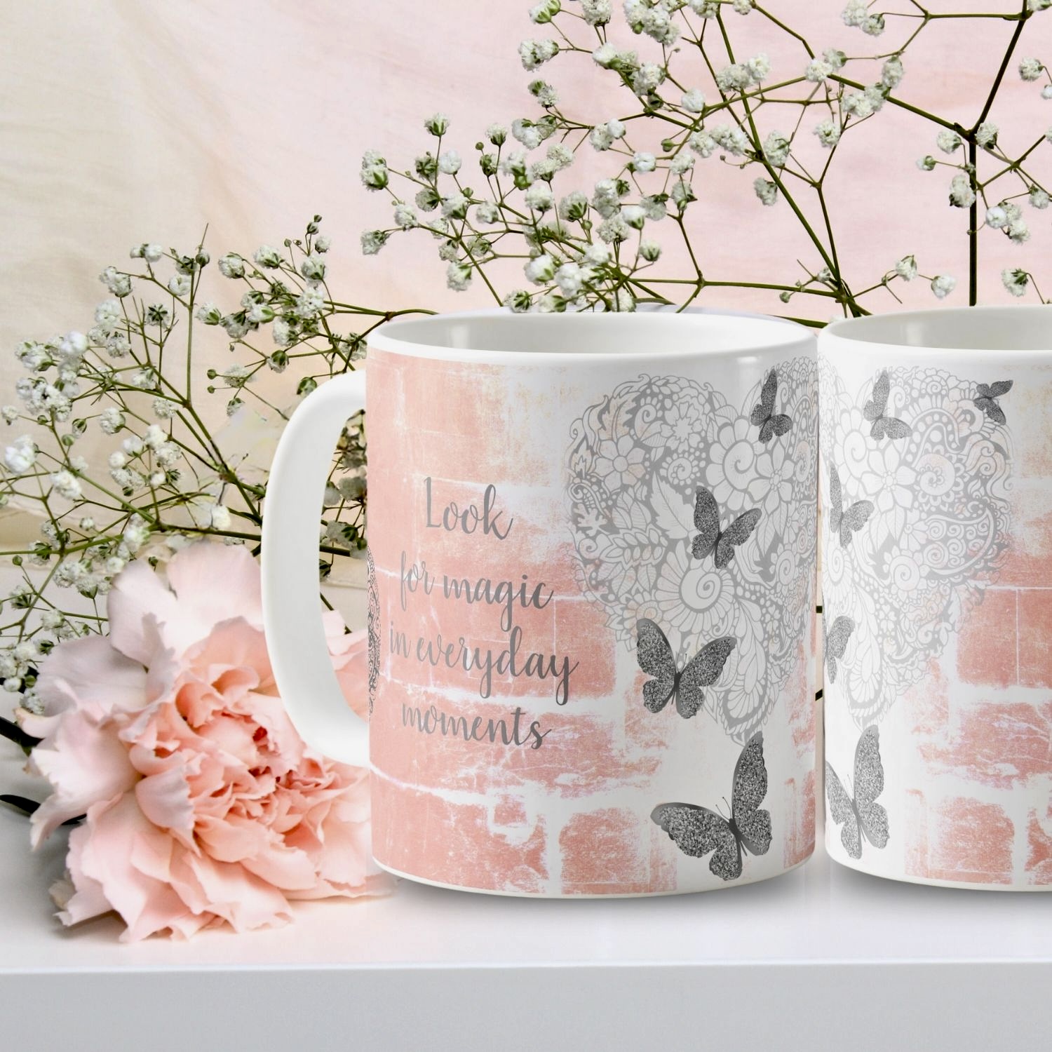 A rustic peach mug featuring a gray heart surrounded by silver butterflies, with an included inspirational message for added charm and elegance.