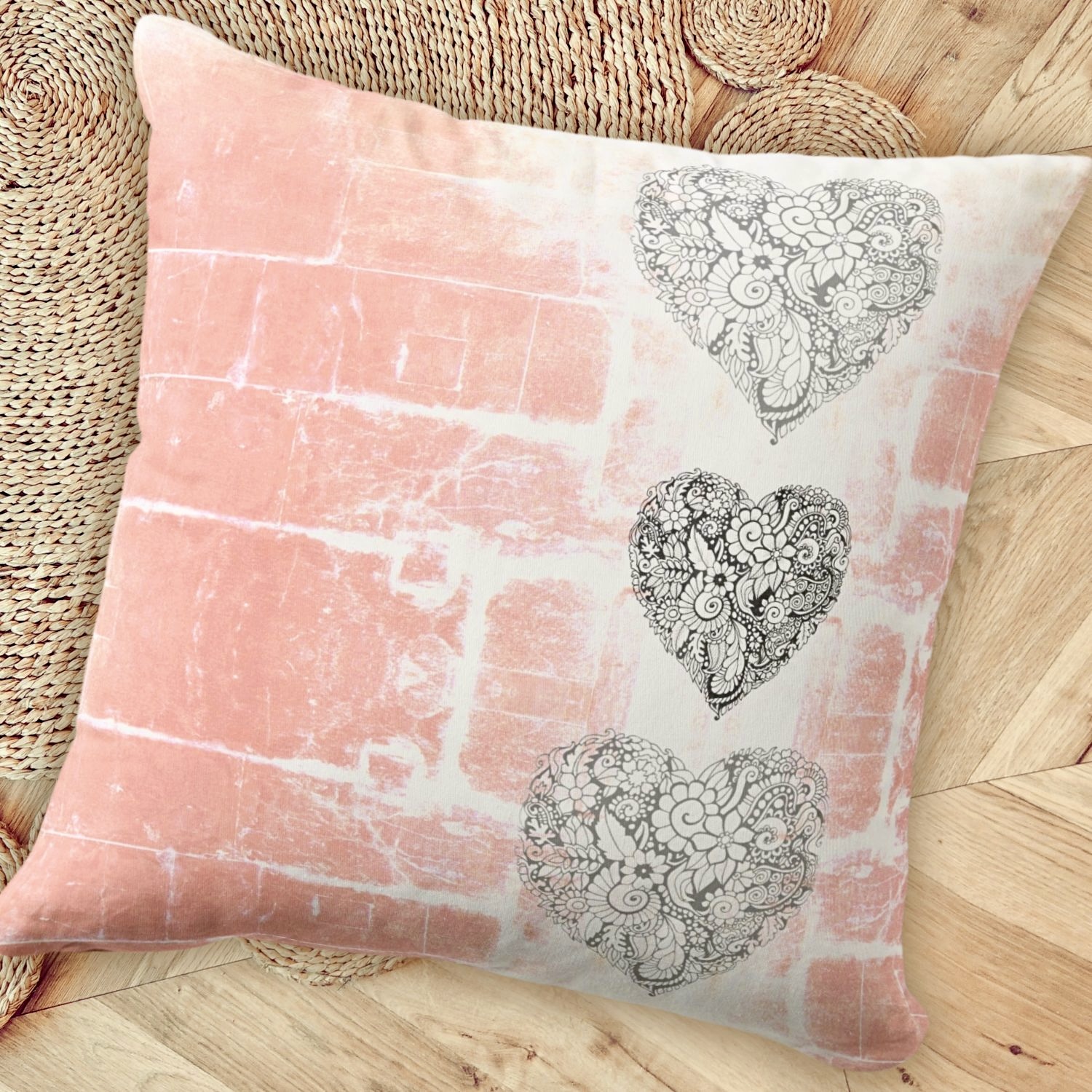 Back side of rustic peach pillow with three heart design arranged vertically, adding charm and character to the decor.