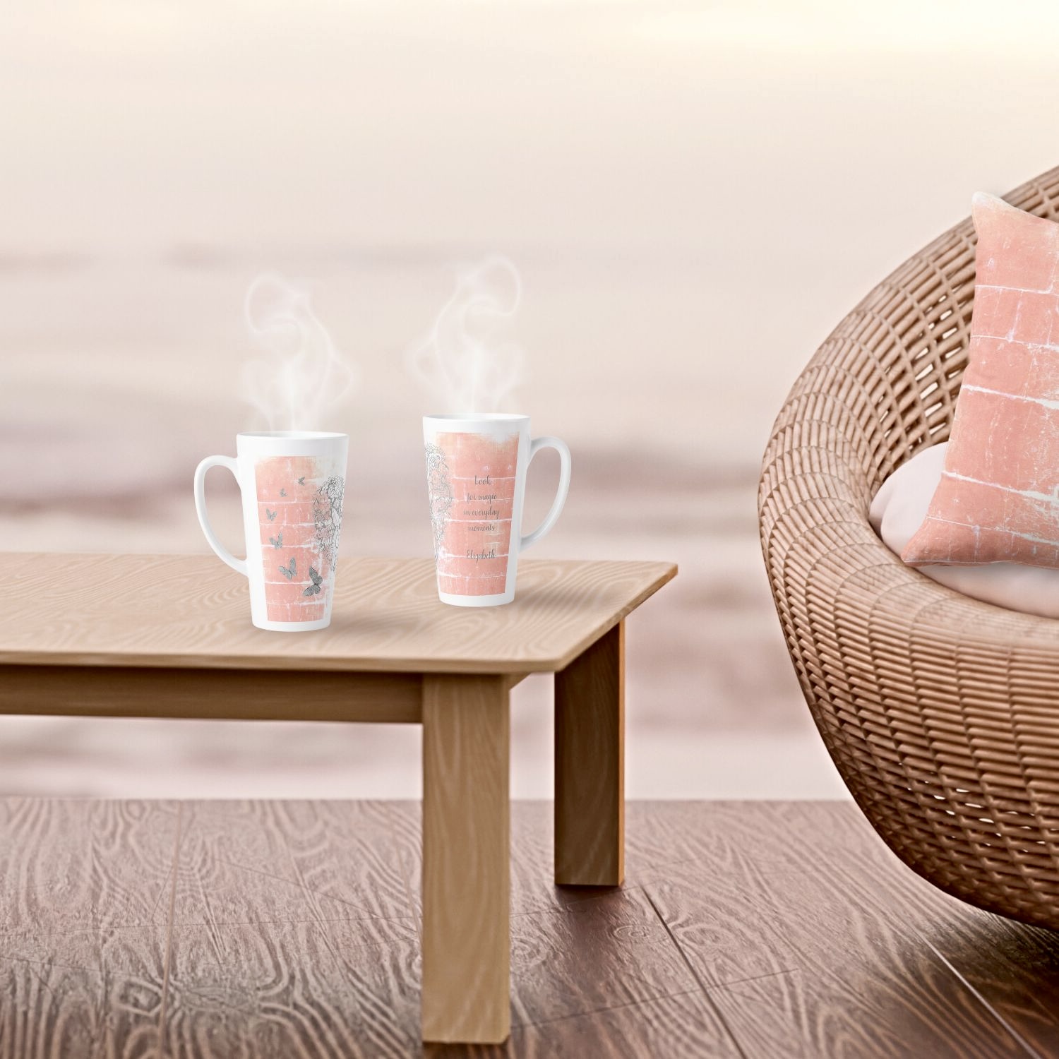 A latte mug and throw pillow featuring matching rustic peach designs, with a gray heart surrounded by silver butterflies, in a coastal-themed ambiance with wicker furniture.