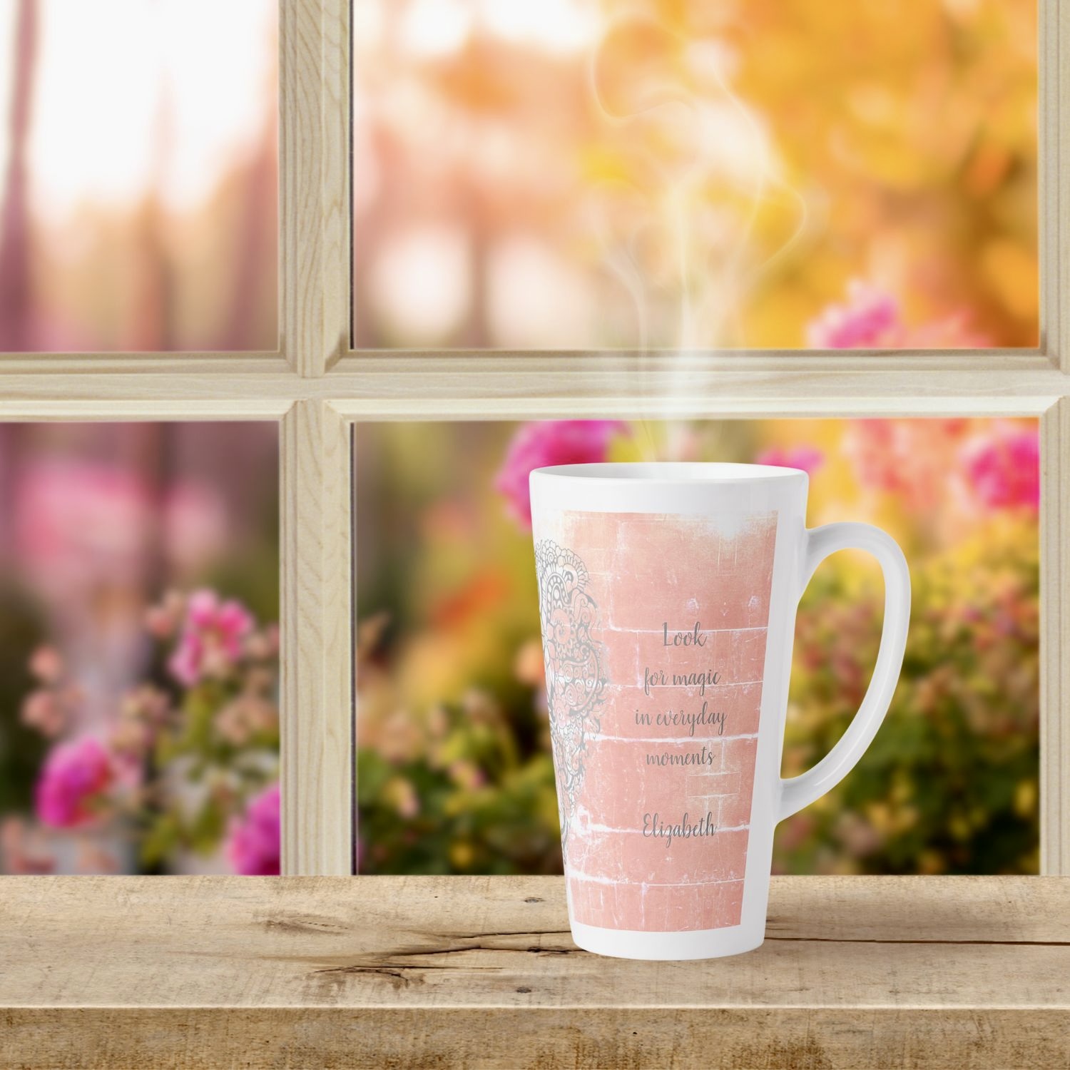 A latte mug featuring a serene peach hue with an inspiring message imprinted on its surface.