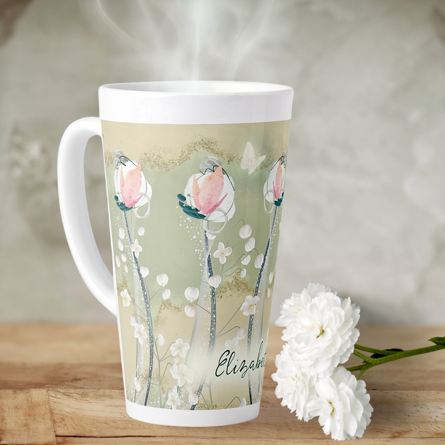 Close-up of a Boho Charm Personalized Latte Mug, featuring a delicate design of moss green and white pastel flowers, accented with earthy beige tones. The intricate floral pattern is complemented by a customizable name or message, adding a personal touch to the mug's charming bohemian style. The close-up view highlights the fine details and glossy finish, inviting a sense of warmth and relaxation. She shed perfect addition.