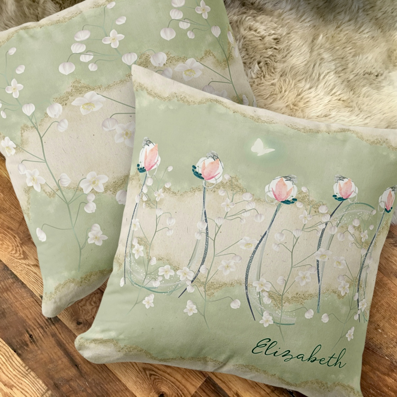 Throw pillow featuring a pattern of delicate white pastel flowers set against a moss green background. The pillow’s bohemian design, with subtle beige accents and an ethereal white butterfly, complements a variety of decor styles. Its soft texture and earthy tones make it an inviting addition to any room, especially in a she shed with throw pillows and mugs that match.