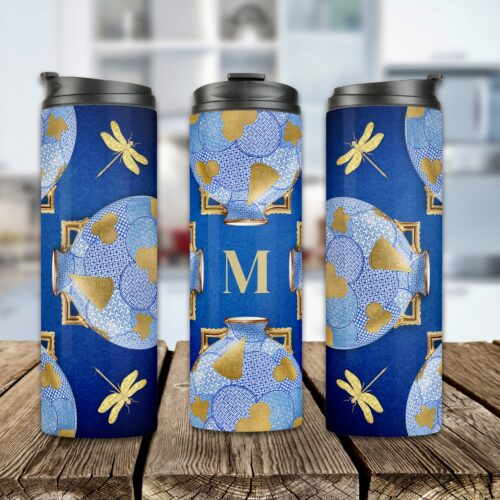 Golden and blue vintage Japanese-style thermal tumbler featuring a central moon flask design with four dragonflies at each corner. The elegant blue and gold artwork, inspired by Japanese artistry and a 1878 moon flask from the Worcester factory, celebrates the timeless allure and authenticity of the Orient.