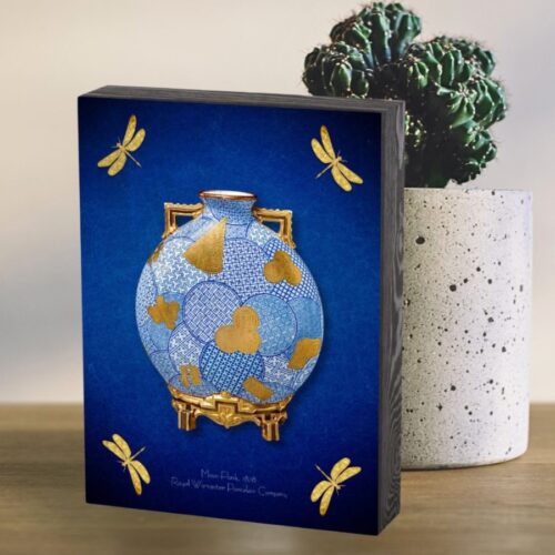 Wooden box featuring a Japanese-style design with a central moon flask and four dragonflies. The blue and gold artwork, inspired by a 1878 Worcester moon flask, reflects Japanese artistry and Oriental charm. The box’s lid showcases the vibrant colors and intricate details with a classic, elegant finish.